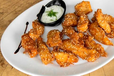 Crispy Breaded chicken with sesame. Closeup. Stock Photos