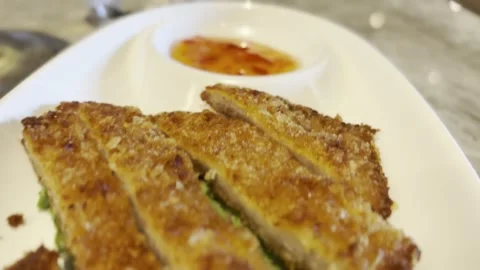 Crispy Breaded Chicken Strips with Lettuce and Sauce Stock Footage 345339525
