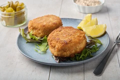 Crispy Breaded Cutlets with Lemon and Fresh Salad Stock Photos