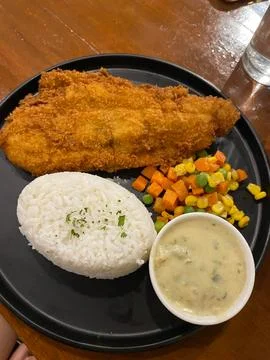 Crispy Breaded Fish Served With Rice Meal Stock Photos
