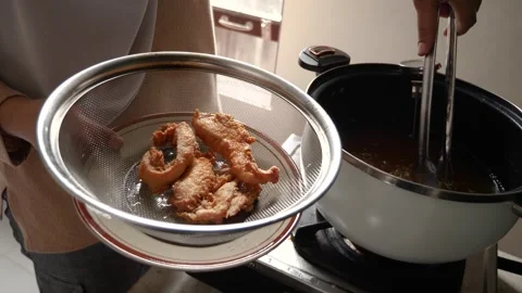 Crispy breaded fried chicken, hot from the fry, ready to serve Stock Footage 280733314