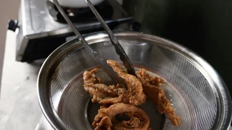 Crispy breaded fried chicken, hot from the fry, ready to serve Stock Footage 280733534