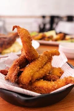 Crispy breaded fried chicken strips in a snack bowl Stock Photos
