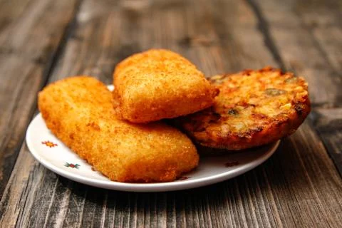 Crispy breaded fried fish fillet and vegetarian burger Stock Photos