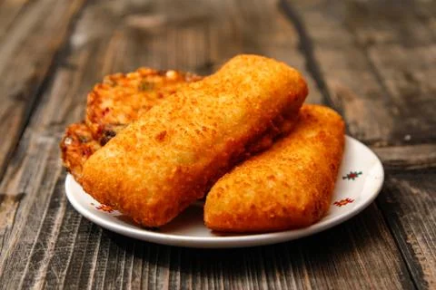 Crispy breaded fried fish fillet and vegetarian burger Stock Photos