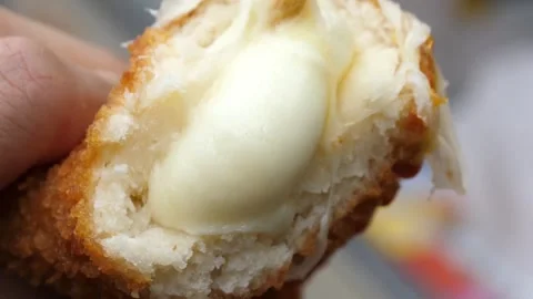 Crispy Breaded Mozzarella Stick Torn Open with Oozing Melted Cheese Stock-Footage 343587722