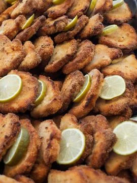 Crispy Breaded Schnitzel with Lemon Garnish Stock Photos