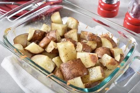 Crispy brown potato cubes Stock Photos