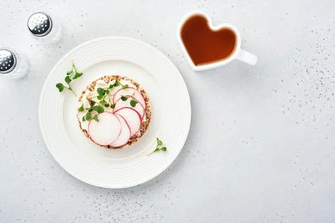 Crispy buckwheat bread cake gluten free with cream cheese, red radish and mic Stock Photos