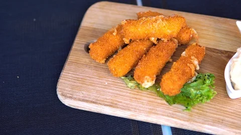 Crispy cheese sticks, baked in batter. Nuggets. Stock Footage 92311998