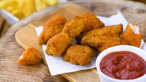 Crispy Chicken Nuggets On A Rotating Pla 