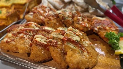 Crispy chicken parmesan with melted cheese and marinara sauce Stock Footage 316812724