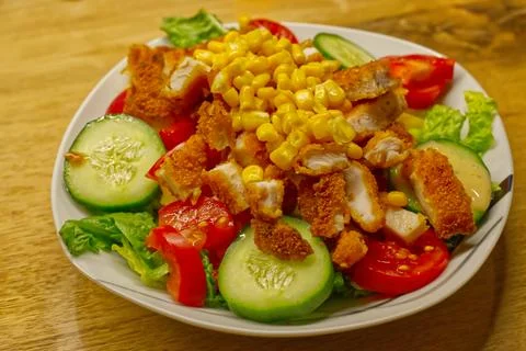 Crispy Chicken Salad with Corn and Fresh Vegetables Stock Photos