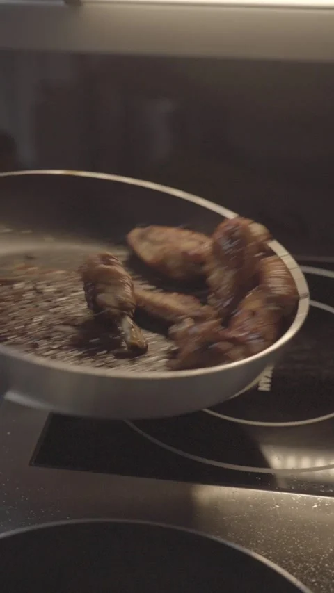 Crispy Chicken Wings Frying in Hot Pan – Cinematic Food Close Up Stock Footage 343301435