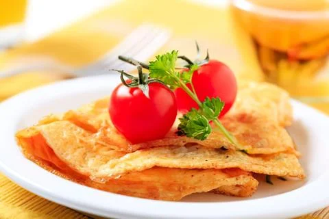 Crispy chips with cherry tomatoes and parsley Stock Photos