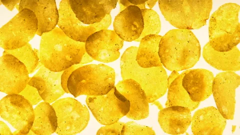 Crispy chips flat-lay on white background, cooking process, junk food concept Stock Footage 100279970