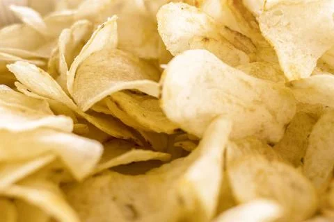 Crispy chips golden pattern Crispy chips golden pattern. Yellow salted pot... Foto stock