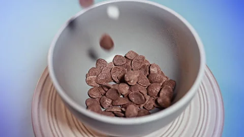 Crispy Chocolate Corn Flakes with Mini Marshmallows in a Grey Bowl Stock Footage 335895422