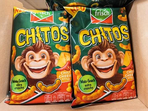 Crispy Corn Snacks with Monkey Mascot Design Stock Photos