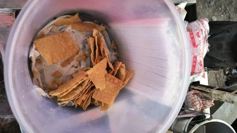 Crispy cracker leftovers plastic container Stock Photos