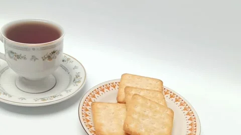 Crispy crackers on plate with black coffee cup isolated white Stock Footage 343510222