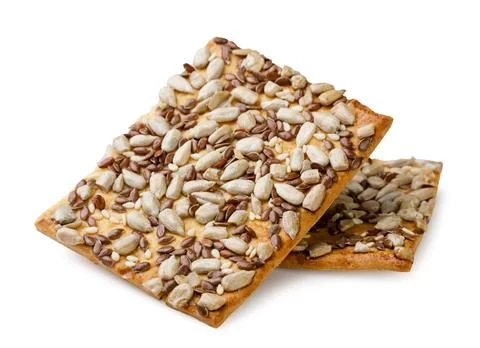Crispy crackers with seeds on a white background. Isolated Stock Photos