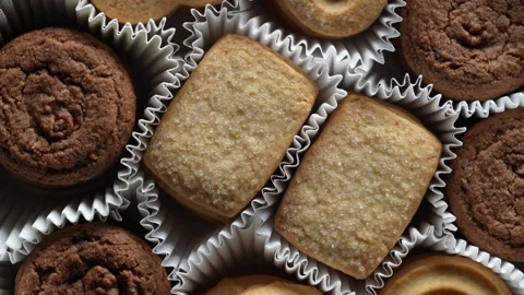 Crispy crumbly shortbread cookies in box, top view, closeup, rotates Stock Footage 313474020