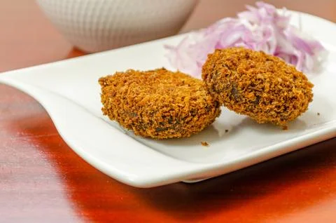 Crispy cutlets in a white plate Stock Photos