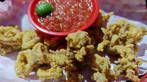 Crispy Deep Fried Calamari Squid Rings Served with Spicy Chili Sambal Sauce Stock-Footage 340993141