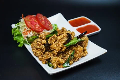 Crispy Deep Fried Chicken Soft Bone with Sesame Seeds, Served with Chili Sa.. 库存照片