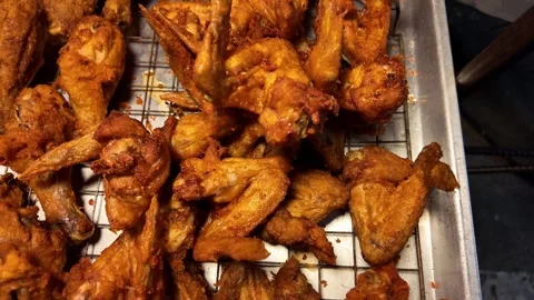 Crispy Deep Fried Chicken Wings and Drumsticks Street Food Video stock 337420893