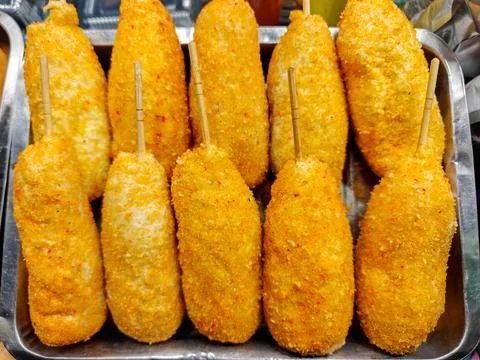 Crispy Deep Fried Corn Dogs on Skewers Displayed in Metal Tray Street Food Stock Photos