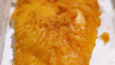 Crispy Details of British Battered Cod in Takeaway Box as Camera Slowly Moves Stock Footage 321797664