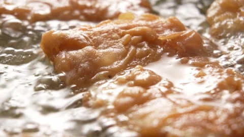 Crispy Fish Fillets Frying in Bubbling Oil. Stock Footage 258571420