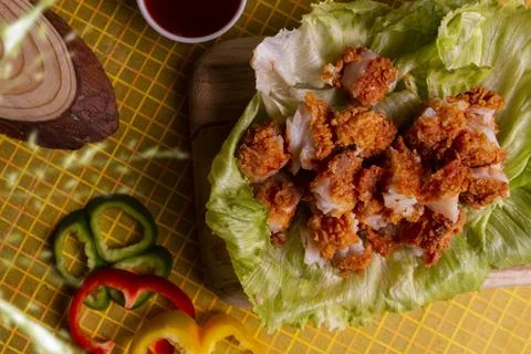 Crispy fish Popcorn with honey mustard sauce on wooden background 스톡 사진