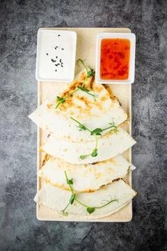 Crispy flatbreads stuffed with meat, herbs, lime and two sauces, top view Stock Photos