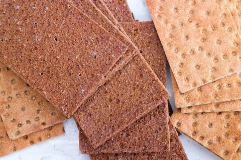 Crispy food on table crispbread flat and dry type of bread and cracker con... Stock Photos