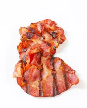 Crispy fried bacon strips on white background Stock Photos