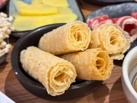 Crispy Fried Bean Curd Rolls (Ring Rolls) Served Black Bowl Hotpot Shabu-Shabu Stock Photos