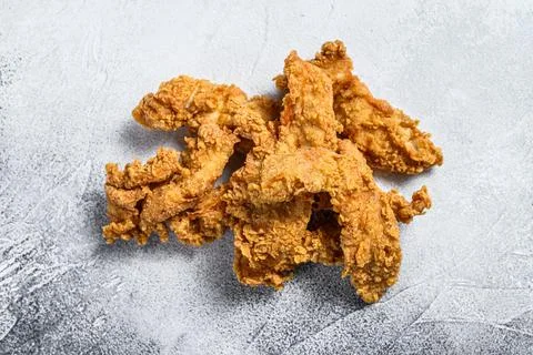 Crispy fried breaded chicken breast strips. White background. Top view Stock Photos