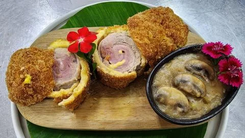 Crispy Fried Chicken Cordon Bleu with Ham Cheese Filling and Mushroom Gravy.. Stock Photos
