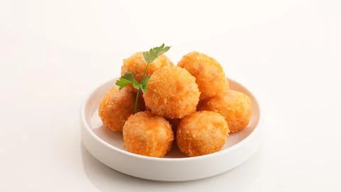 Crispy Fried Chicken Cordon Bleu Bites on a White Plate Фото