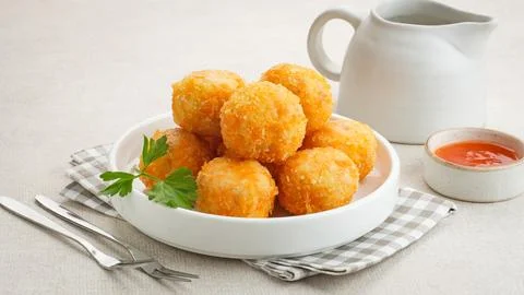 Crispy Fried Chicken Cordon Bleu Bites on a White Plate 스톡 사진