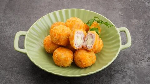 Crispy Fried Chicken Cordon Bleu Bites on a White Plate Fotos Stock