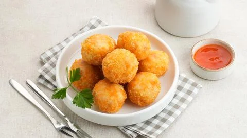 Crispy Fried Chicken Cordon Bleu Bites on a White Plate Stock Photos