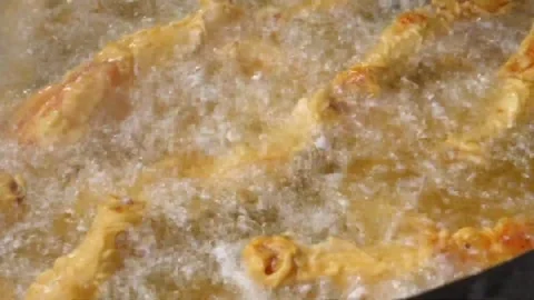 Crispy Fried Chicken Deep Frying in Hot Boiling Oil Video stock 343587877