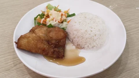 Crispy fried chicken with fish sauce on rice. Thai food Stock Footage 324599105