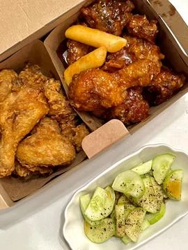 Crispy fried chicken with golden, crunchy skin and juicy, tender meat. A de.. Stock Photos