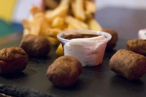 Crispy fried chicken nuggets, fried meat cutlets rissole meatballs of minced  Stock Photos