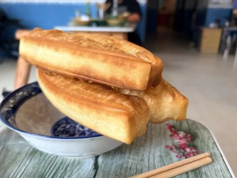Crispy Fried Dough Sticks Served in a Traditional Bowl Stock Photos
